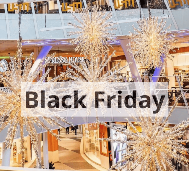 Glittrande dekorationer och butiker på kvarteret Utopia under Black Friday, en dag fylld med shopping och erbjudanden.